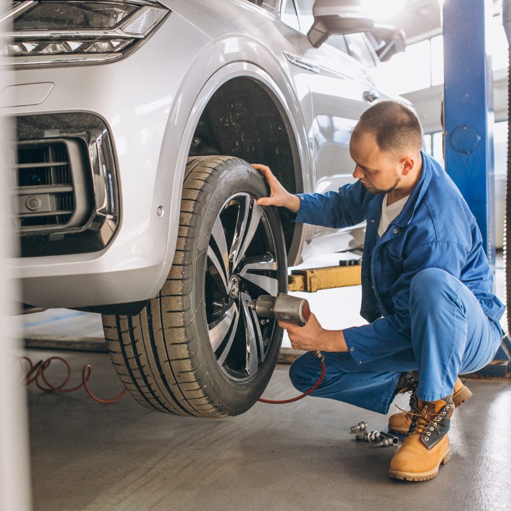 auto-mechanic-checking-car